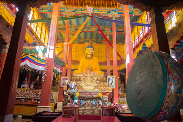 golden buddha statue in ladakh monastery 