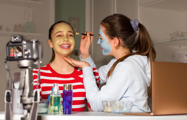 Two Teenager bloggers test beauty products for their followers and tell their impressions, opinions. Teenagers' communication concept, virtual and digital community that grows every day.