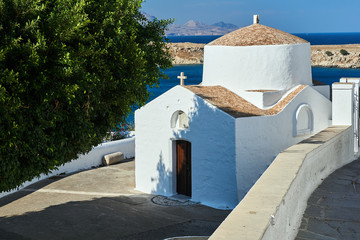 A stone, orthodox, historic chapel in the city of Lindos on the island of Rhodes in Greece.
