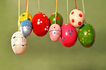 Hanging Easter Eggs. Colorful easter eggs decorated on pink background