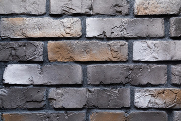 close-up of a brown graphite brick wall with brown spots