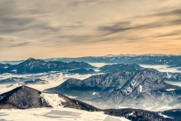 Winter landscape with a mountain forest.