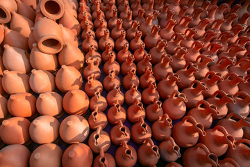 Fototapeta na wymiar top view ceramic jugs pattern for wine in a street market