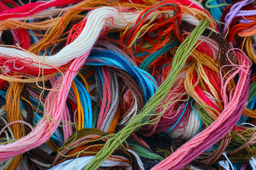 Colored embroidery threads. Full frame.