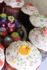 Easter cakes and eggs on bright background