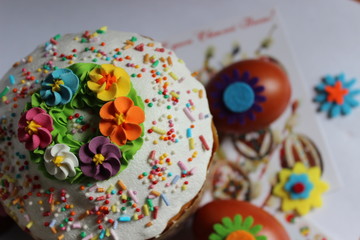 Bright Easter picture with cake and eggs on Easter background for celebration