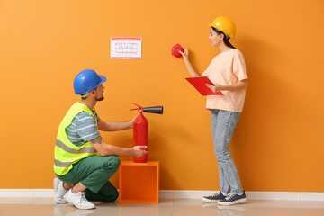 Fire safety specialists inspecting building