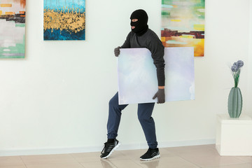 Thief stealing picture from art gallery - obrazy, fototapety, plakaty