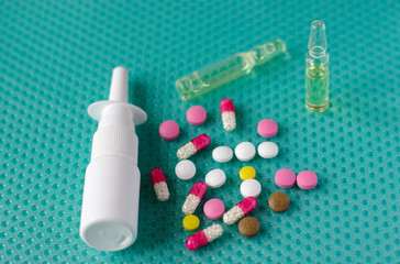 Pills, ampoules with medicine and cold spray