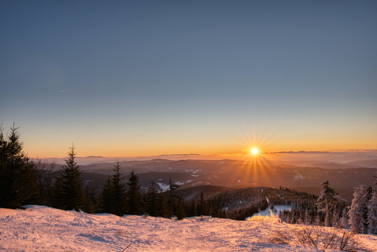 Scenic image of Winter Landscape during sunset. Frosty morning with Colorful sky, calm wintry scene. Czech beskydy