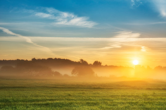 Beautiful summer sunrise over fields © Piotr Krzeslak
