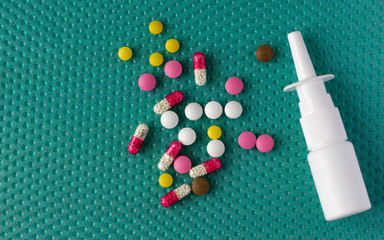 Antibiotics and vitamins on a blue background