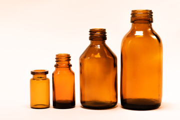 Vials on white background. Yellow vials. Medicine bottles on a white background.