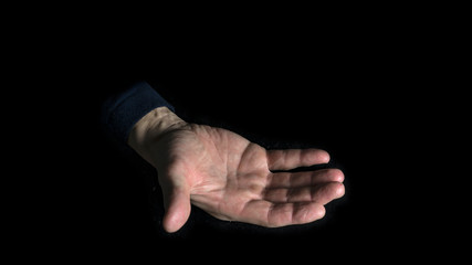 Empty open hand on a black background