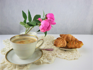 breakfast with cup of coffee and croissants