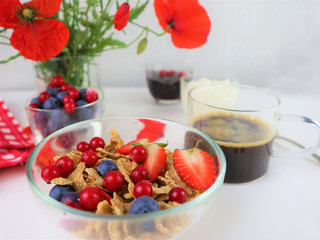 Breakfast served with coffee, cereals and fruits.