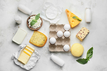 Different dairy products on light background