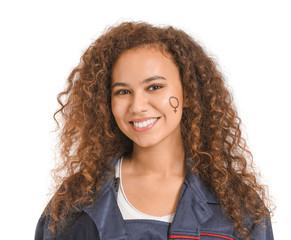 African-American female worker with symbol of woman drawn on her face against white background. Concept of feminism