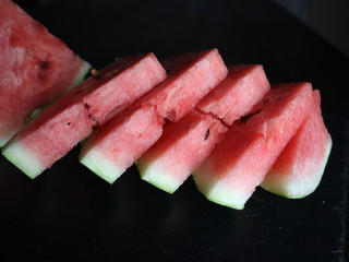  watermelon sliced on black background