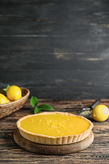Tasty homemade lemon pie on table