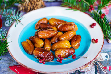 Christmas Card with Dried Fruits and Pine Branches .Christmas Background Concept with Dates