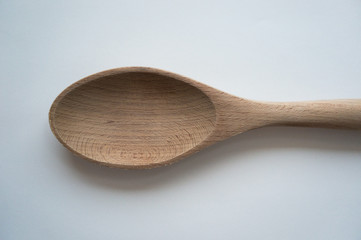 Wooden kitchen utensils on white background