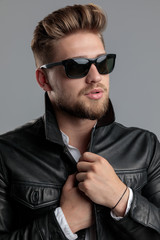 Fototapeta premium sexy young model wearing leather jacket and sunglasses