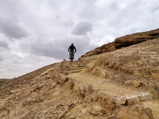 Mountain biker on an ancient staircase