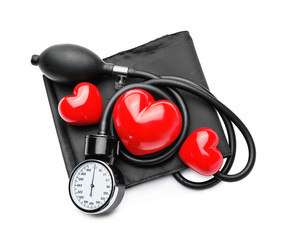 Plakat Sphygmomanometer with red hearts on white background