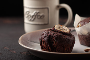 Tasty homemade chocolate muffin with banana. Chocolate cake with coffee.