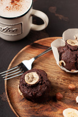 cup of coffee with chocolate muffin close-up