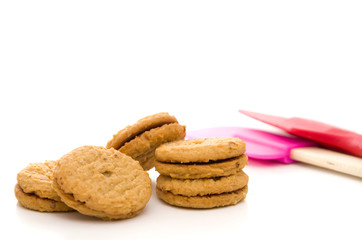 Cookies with Red and Pink Spatulas Isolated on White