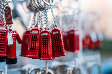 Sale of many key chains of the typical london red phone booth in a street market