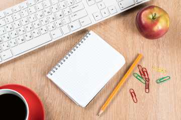 Stationery stuff on wooden table from top view