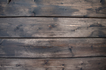 Cracked wood background. Dark old wooden planks. Horizontal lines on fence.