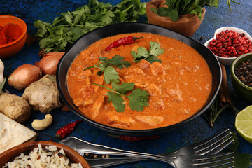 Chicken tikka masala spicy curry meat food in pot with rice and naan bread. indian food