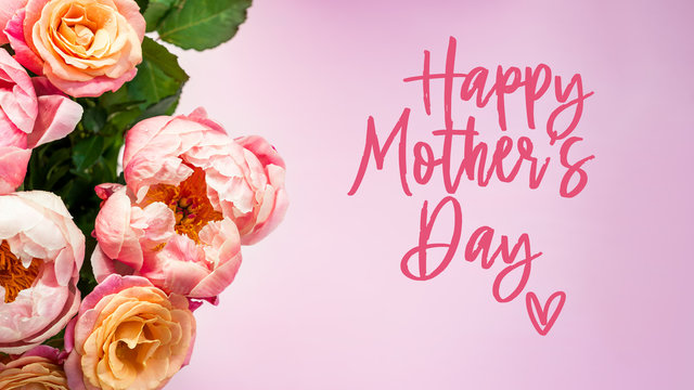 Fresh bunch of pink peonies and roses and text Happy Mothers Day. Card Concept, pastel colors, close up image