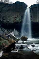 Fototapeta na wymiar Beautiful waterfall and mossy rocks