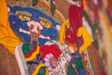 Fototapeta na wymiar Buddhist paintings on the wall in Hemish monastery, ladakh