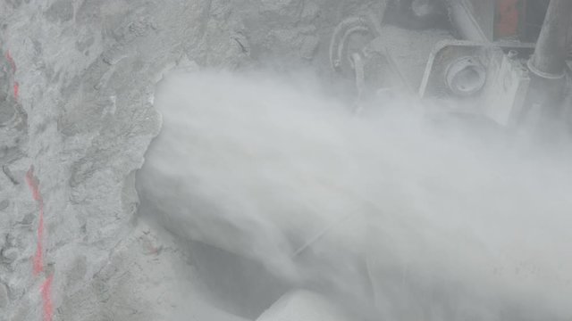 Horizontal drill rig cutting utilities tunnel into limestone rock