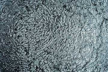 Unusual shiny surface close-up. Gray grungy background for sites and layouts.