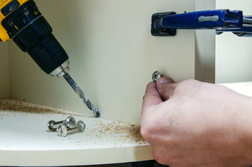 Assembly of hard furniture, close-up drawers for drawers