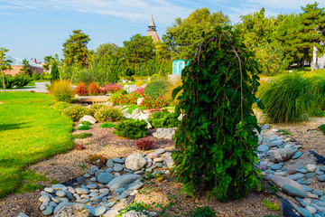 Flowerbeds, Grass Pathway and Ornamental Vase in a Formal Garden