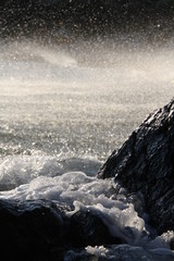 Evening sea wave at rocks