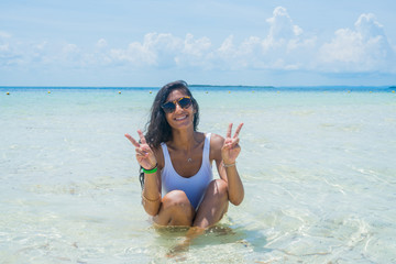 Young indian woman doing victory gesture