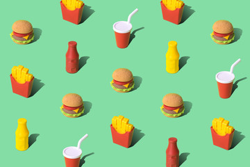 Fast food texture made of disposable cup, mustard and ketchup bottles with burger and french fries abstract on green.