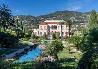 Fototapeta na wymiar Rothschild public garden and villa in a sunny day in France 