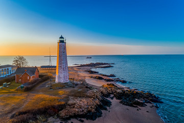 Lighthouse and Oyster Boat at Sunrise on New Haven Harbor - obrazy, fototapety, plakaty