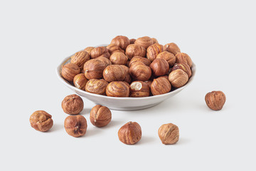 Shelled hazelnuts in a small plate