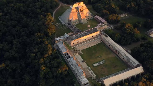 Aerial, drone shot, tilting over the Uxmal ruins, UNESCO World Heritage Site, at sunset, in Yucatan, Mexico